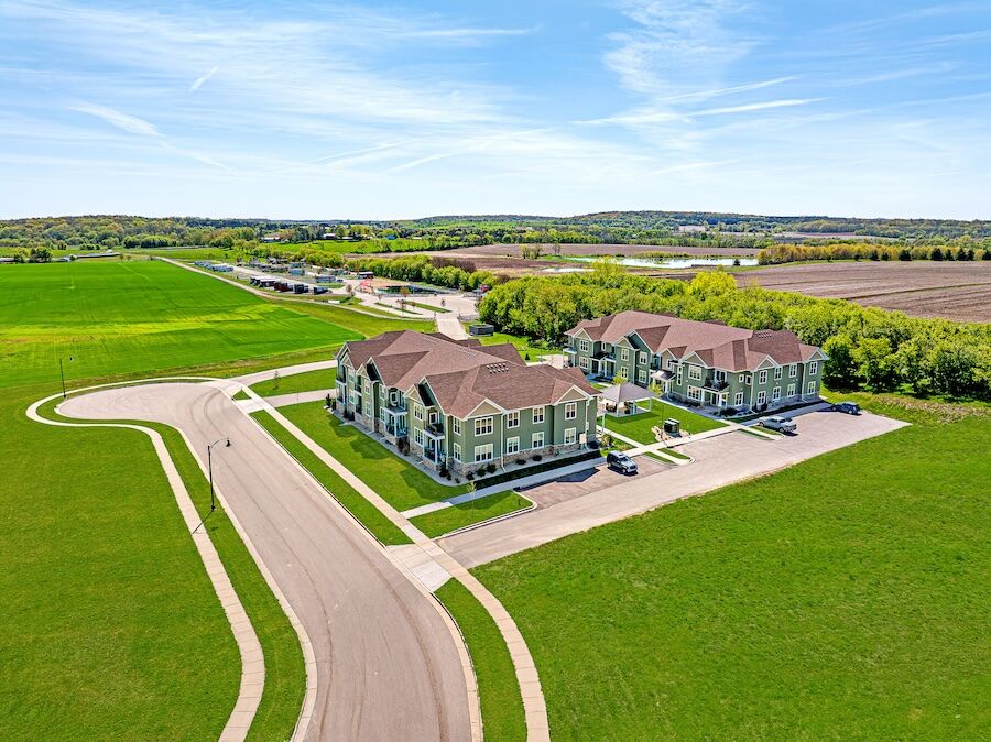 Aerial view of the Whistling Ridge buildings surrounded by green fields